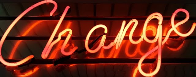 Neon sign spelling "change"